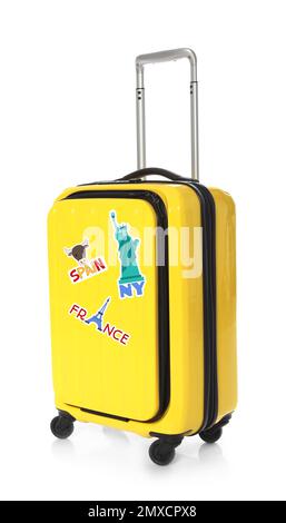 Moderner Koffer mit Reiseaufklebern auf weißem Hintergrund Stockfoto