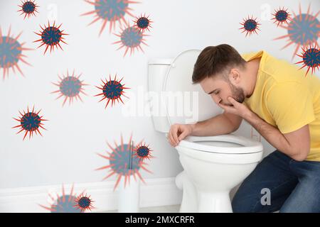 Junger Mann mit Übelkeit über Toilettenschüssel und Bakterienillustrierung. Lebensmittelvergiftung Stockfoto