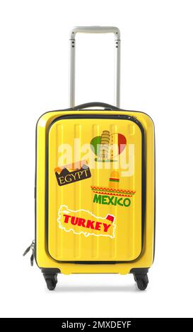 Moderner Koffer mit Reiseaufklebern auf weißem Hintergrund Stockfoto