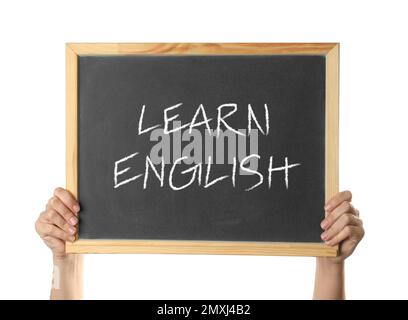 Frau, die eine Tafel mit Text hält, lernt Englisch auf weißem Hintergrund, Nahaufnahme Stockfoto
