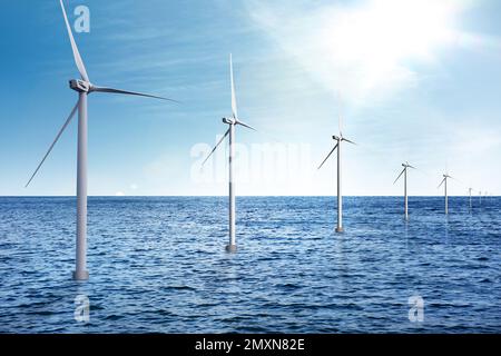 Schwimmende Windturbinen im Meer. Alternative Energiequelle Stockfoto