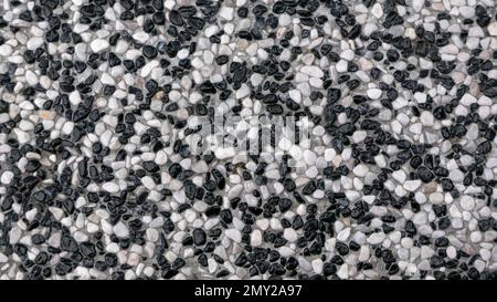 Zusammenfassung Hintergrund Pflaster bestehend aus kleinen Kieselsteinen, die eingebettet in Zement Stockfoto