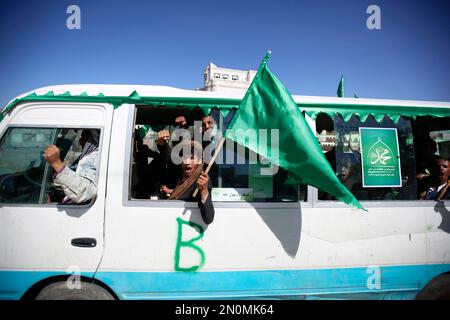 Shiite rebels, known as Houthis, chant slogans as they mark the holy ...