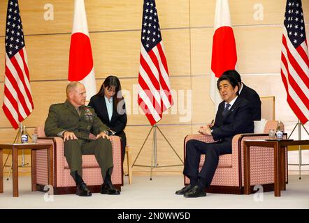 Gen. Robert B. Neller, left, Commandant of the U.S. Marine Corps, talks with Japanese Prime Minister Shinzo Abe, right, at Abe's official residence in Tokyo, Wednesday, Nov. 25, 2015. (AP Photo/Shizuo Kambayashi, Pool)