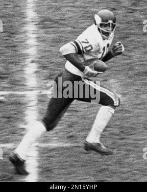 Jim Marshall (70), Minnesota Vikings defensive end, is congratulated in the  end zone by Bruce Bosley (77) of the San Francisco 49ers after he scooped  up a 49ers' fumble and ran 60