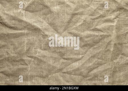 Textur einer alten grünen Plane mit Spuren von Verschleiß. Stockfoto