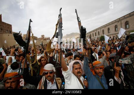 Shiite rebels, known as Houthis, chant slogans as they mark the holy ...