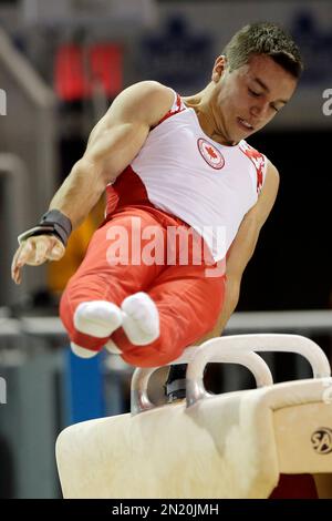 Canada's Rene Cournoyer performs during artistic gymnastics pommel horse competition in the Pan Am Games in Toronto, Tuesday, July 14, 2015. (AP Photo/Gregory Bull)