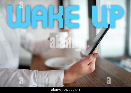 Textunterschrift für Wake-up. Ein Wort für einen Fall, in dem eine Person aufwacht oder aufgeweckt wird, steht auf Stockfoto