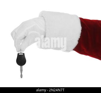 Der Weihnachtsmann hält den Autoschlüssel auf weißem Hintergrund, Nahaufnahme der Hand Stockfoto
