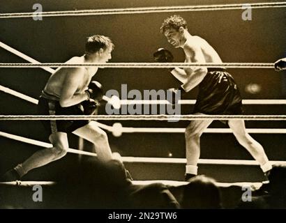 1938 , 11 . märz , Madison Square Garden , New York , USA : der gefeierte amerikanische Boxer MAX BAER ( 1909 - 1959 ) , auf diesem Foto, während des Spiels mit dem britischen TOMMY FARR ( 1913 - 1986 ) , gewonnen von Baer . Max Baer war Weltmeister im Schwergewicht 1934 bei der italienischen Primo Carnera . UNBEKANNTER FOTOGRAF .- GESCHICHTE - FOTO STORICHE - BOX - PESI MASSIMI - SPORT - BOXER - PORTRÄT - RITRATTO -- ARCHIVIO GBB Stockfoto