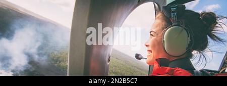 Hubschrauberrundflug Abenteuer Reise asiatische Touristen glücklich über die Landschaft des Vulkanausbruchs über den Vulkandämpfen auf Big Island Stockfoto