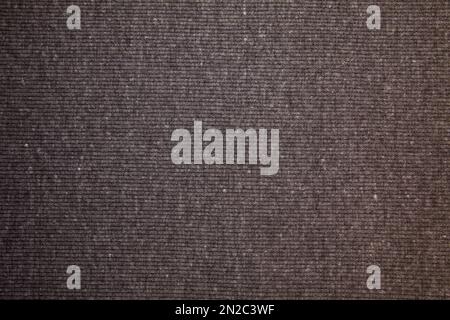 Schwarzer Stoffhintergrund. Schwarzes Stoffgewebe Textilmaterial. Stockfoto