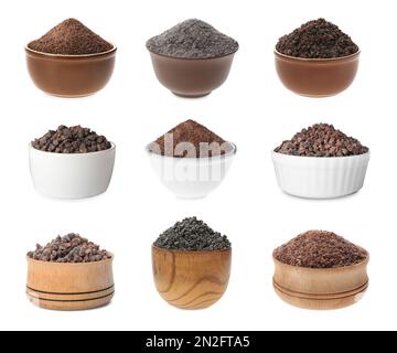 Set mit Schüsseln mit schwarzem Salz auf weiß isoliert Stockfoto