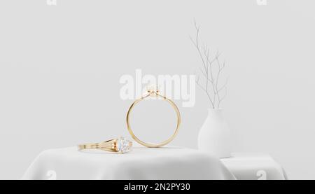 Goldene Diamantringe 3D-Rendering auf einem dekorierten Tuch Stockfoto