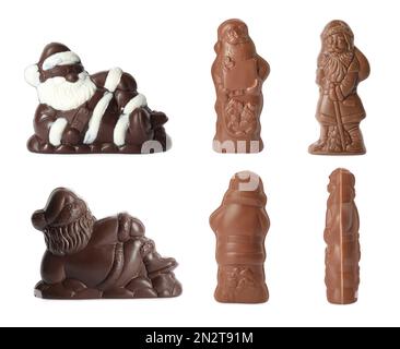 Set mit Weihnachtsmann-Figuren aus Schokolade auf weißem Hintergrund, Blick von verschiedenen Seiten Stockfoto