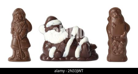 Set mit Weihnachtsmann-Figuren aus Schokolade auf weißem Hintergrund, Bannerdesign Stockfoto