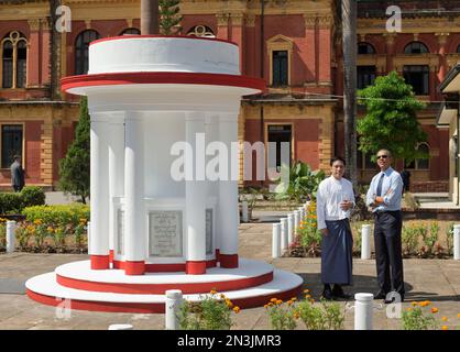 U.S. President Barack Obama, right, stops at the memorial to the Independence Martys, where the first Burmese flag was raised, during his tour of the Secretariat Building with Thant Myint-U, left, founder and president of Yangon Heritage Trust, Friday, Nov. 14, 2014 in Yangon, Myanmar. (AP Photo/Pablo Martinez Monsivais)