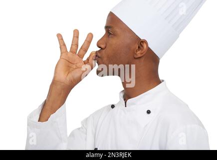 Magnifique. Profil eines afrikanischen Küchenchefs, der seine Hand perfekt küsst. Stockfoto