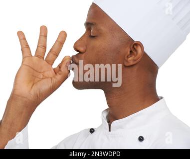 Magnifique. Profil eines afrikanischen Küchenchefs, der seine Hand perfekt küsst. Stockfoto
