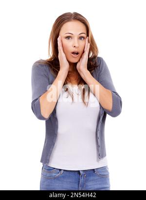 Oh no, thats awful. Casually dressed woman looking surprised while isolated on white. Stockfoto