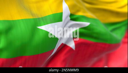 Detail der Myanmarer Nationalflagge flattern. Die Flagge hat horizontale gelbe, grüne und rote Streifen mit einem weißen 5-Punkt-Stern in der Mitte. 3D Abbildung Stockfoto