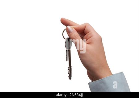 Die Hand hält Hausschlüssel. Konzept des Kaufs oder Verkaufs von Wohnungen Stockfoto
