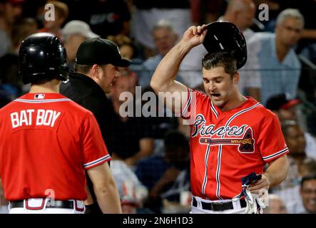 Atlanta Braves' Dan Uggla, right, bangs forearms with Chipper