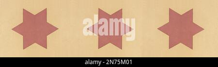 Drei rote Sterne mit gelbem Hintergrund in glatt geschliffenem Stein Stockfoto