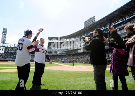 Former Chicago White Sox player Mike Squires, from the 1983 team throws out  the ceremonial first pitch before an MLB baseball game between the Chicago  White Sox and the Minnesota Twins in