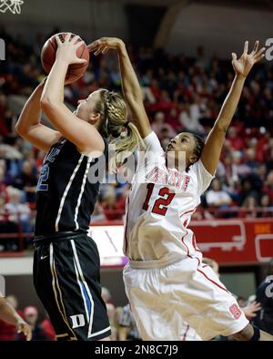 Duke's Tricia Liston, left, shoots as Presbyterian's Chelsea Parker (11