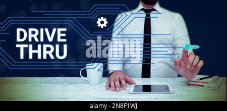 Schreiben mit Text Drive Thru. Ein Wort für einen Ort, an dem man die Art von Service bekommen kann, indem man sie durchfährt Stockfoto