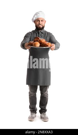 Männlicher Bäcker mit Backblech auf weißem Hintergrund Stockfoto