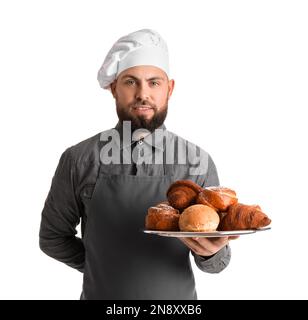 Männlicher Bäcker mit Backblech auf weißem Hintergrund Stockfoto