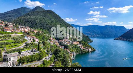 Blick aus der Vogelperspektive auf Nesso, ein malerisches und farbenfrohes Dorf am Ufer des Comer Sees, Italien Stockfoto