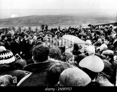 File - Pallbearers carry one of 13 coffins of Bloody Sunday victims to a graveside during a funeral in Derry, Northern Ireland, following requiem mass at nearby St. Mary's church at Creggan Hill on in this b/w Feb. 2, 1972 file photo. Chief Constable Matt Baggott told Northern Ireland’s policing board Thursday July 5 2012 that his force is planning a Bloody Sunday investigation that would require 30 detectives and take four years. Northern Ireland’s police commander says his detectives will eventually investigate the Bloody Sunday massacre to determine whether any British soldiers should be ch