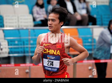 Astana, Kasachstan. 12. Februar 2023. Wang Fudong aus China tritt beim 3000m. Finale der Männer bei den 10. Asian Indoor Athletics Championships in Astana, Kasachstan, am 12. Februar 2023 an. Kredit: Kalizhan Ospanov/Xinhua/Alamy Live News Stockfoto