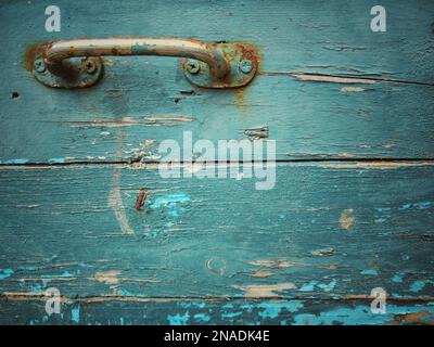 Alte Holzplatte mit Griffhintergrund Stockfoto