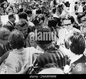 More than hundred newsmen and photographers crowded Munich’s airport Riem, in Germany, on June 23, 1966, when world famous beat-band The Beatles, arrived for a four-days-tournament through West Germany. In front left to right the Beatles, George Harrison, Ringo Starr and Paul McCartney. (AP Photo)