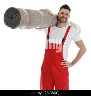 Männlicher Arbeiter mit Rollteppich auf weißem Hintergrund Stockfoto