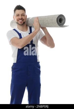 Männlicher Arbeiter mit Rollteppich auf weißem Hintergrund Stockfoto