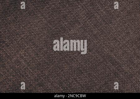 Gewebte Polsterung im Jacquard-Design, dunkelbraune, grobe Gewebestruktur mit diagonalen Weblinien. Textilhintergrund, Möbeltextilien, Tapete, Rückseite Stockfoto