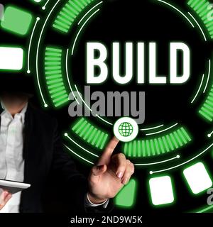 Schreiben mit Anzeige von Text Build. Konzeptfoto Konstruieren Sie etwas, indem Sie Material über einen bestimmten Zeitraum zusammenstellen Stockfoto