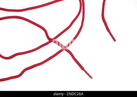 Eine Nahaufnahme des Materials mit roter Schuhspitze auf weißem Hintergrund Stockfoto