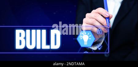 Textbeschriftung zur Präsentation des Builds. Ein Wort für etwas konstruieren, indem man Material über einen bestimmten Zeitraum zusammenstellt Stockfoto