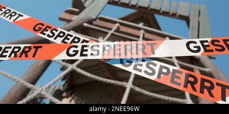 Barrierebänder mit dem deutschen Wort Stockfoto