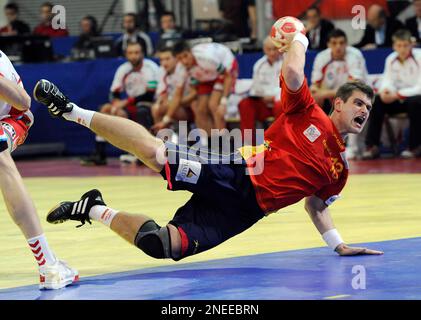 Julen Aguinagalde of Spain scores during the men's handball European Championship second round match against Poland in Innsbruck, Austria, on Sunday, Jan. 24 , 2010. (AP Photo/Kerstin Joensson)