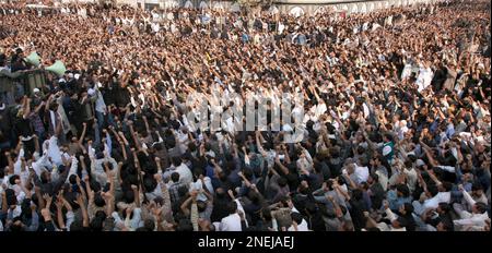 Shiite Muslims chant religious slogans during a Muharram procession, in ...
