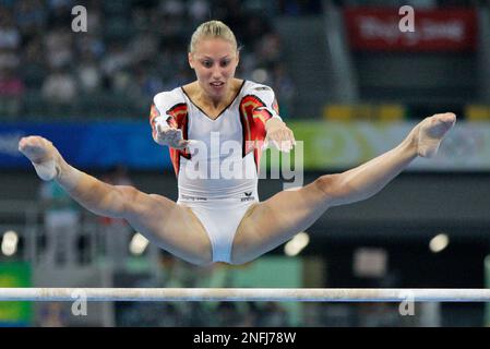 German gymnast Marie-Sophie Hindermann performs on the uneven bars during the women's qualification rounds at the Beijing 2008 Olympics in Beijing, Sunday, Aug. 10, 2008. (AP Photo/Amy Sancetta)