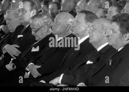 West German politicians and other high ranking personalities are pictured during the funeral ceremony of the richest West German industrialist, Friedrich Flick, in Dusseldorf, West Germany, July 28, 1972. From left to right: Ludwig Erhard, Hans-Dietrich Genscher, Dr. Hermann J. Abs, chairman of the supervisory board of the Deutsche Bank, Hans-Guenther Sohl, Rudi Josten, Fritz Berg and Franz-Josef Strauss. (AP Photo/Heribert Proepper)